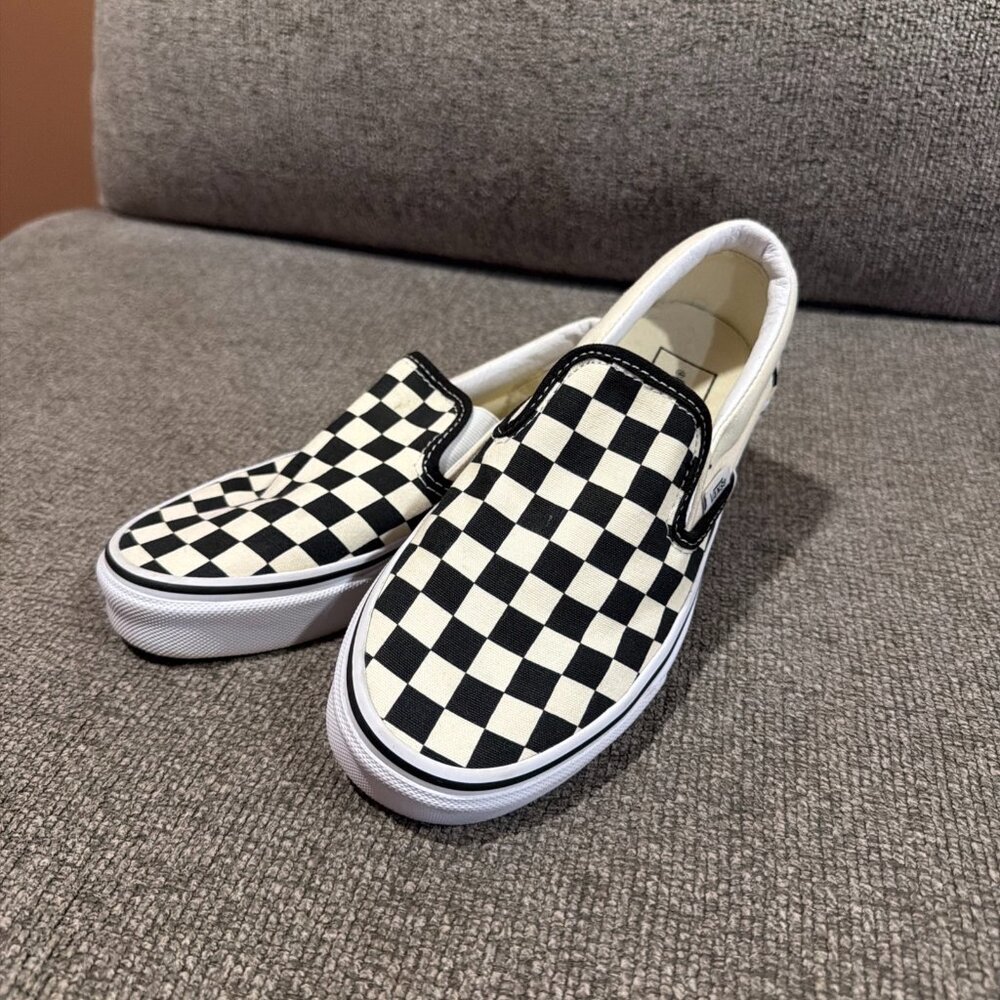 The Vans Checker Creme and Black Slip On Classic Sneakers in size Mens 4 and Wom